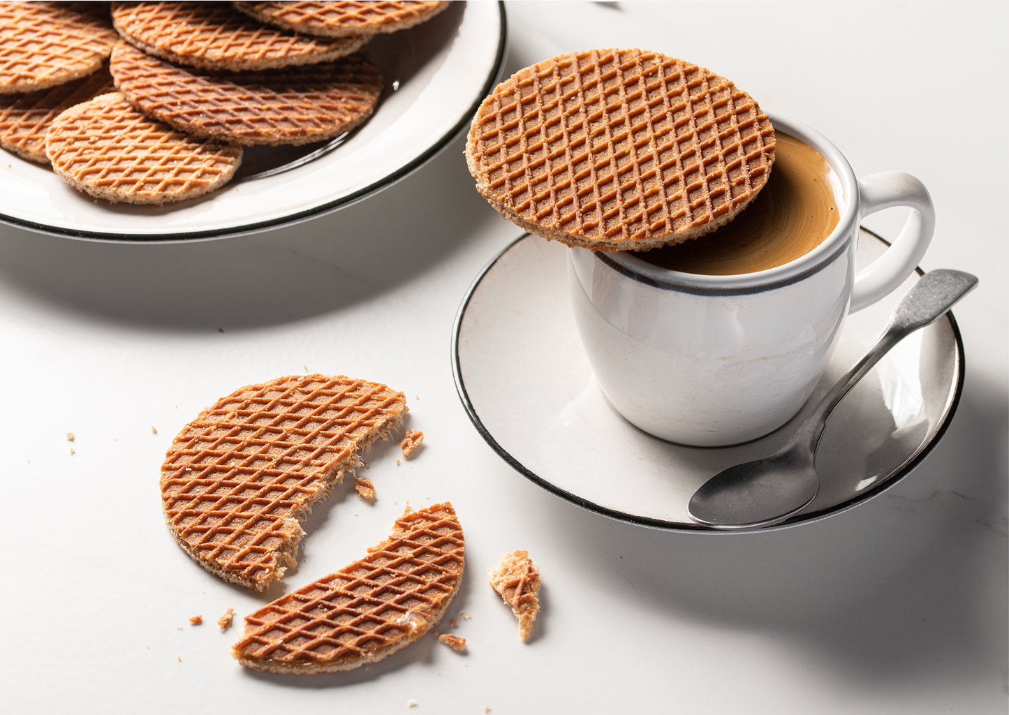 Authentic Wonderen Stroopwafels - 8 pack on a white plate.