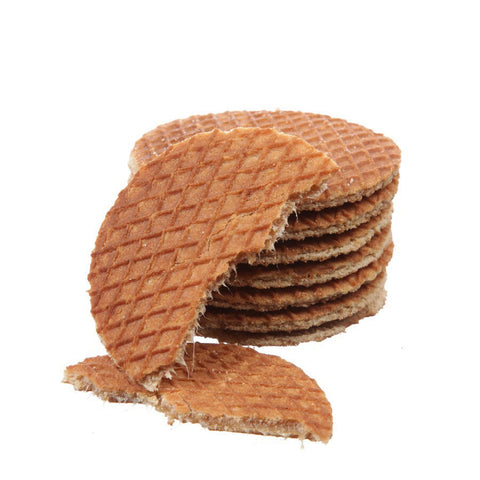 A stack of tasty treats on a white background, including Wonderen Stroopwafels' Vegan Friendly Stroopwafels.